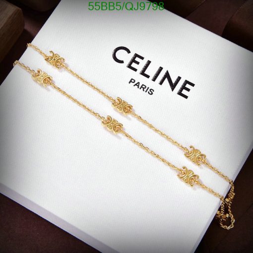 Gold bracelet with decorative elements on Celine Paris box.