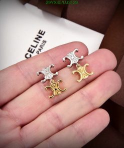 Designer logo earrings on hand with packaging.