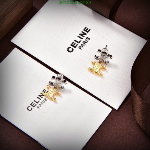 Celine Paris luxury earrings on display card.