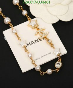 Elegant pearl and star gold-tone bracelet on display.