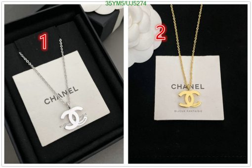 Two Chanel logo necklaces, one silver, one gold.