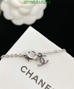 Silver bracelet with lobster clasp and charm detail.