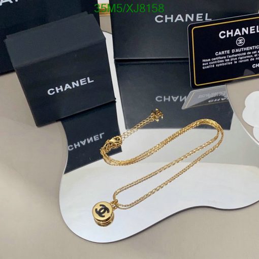 Chanel branded jewelry and packaging on display.