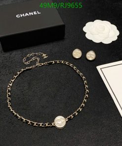 Chanel necklace and earrings set with brand packaging.