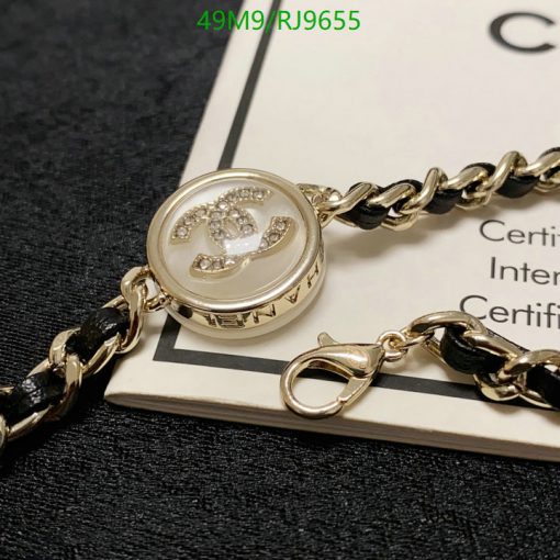 Designer gold-tone bracelet with certification card.