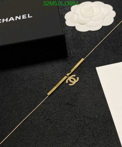 Chanel branded box and accessory on elegant background.