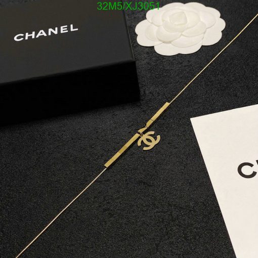 Chanel branded box and accessory on elegant background.