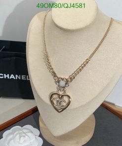 Elegant heart pendant necklace display with luxury branding.