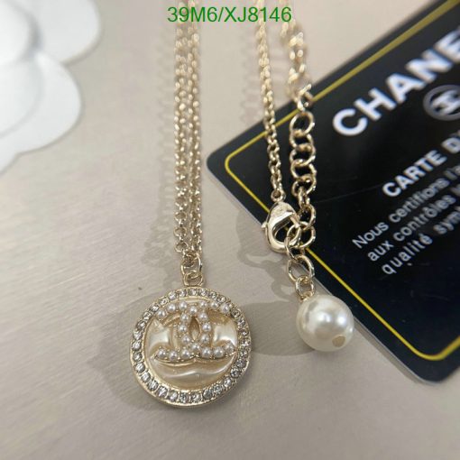 Designer pendant necklace with pearl detail.