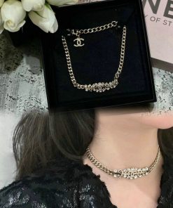 Woman wearing a designer chain necklace.