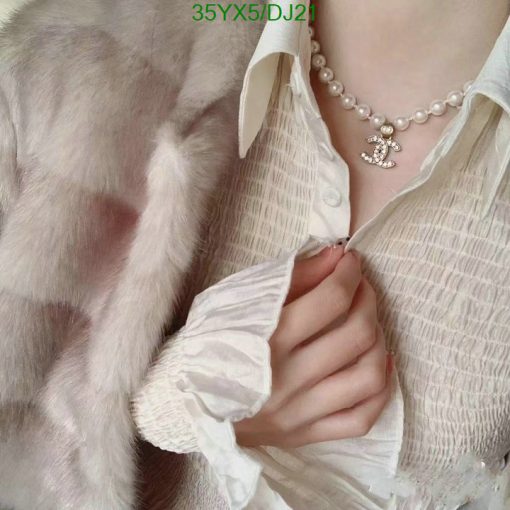 Elegant pearl necklace and chic fur coat fashion.