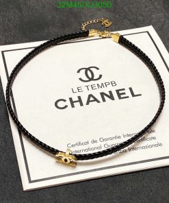 Black leather bracelet with gold clasp on certificate.