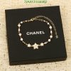 Chanel star charm bracelet on black box.