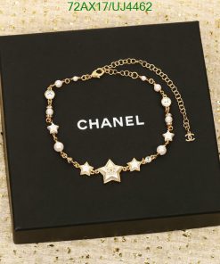 Chanel star charm bracelet on black box.