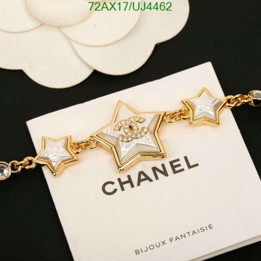 Gold star bracelet on branded card.