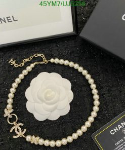 Chanel pearl necklace with camellia flower and authenticity card.