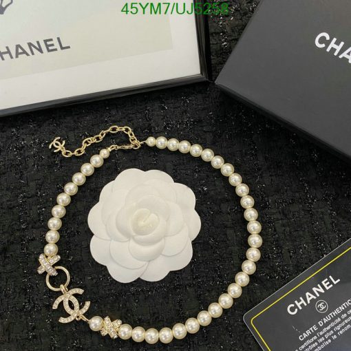 Chanel pearl necklace with camellia flower and authenticity card.