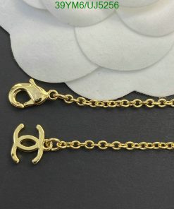 Gold chain necklace with lobster clasp detail.