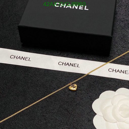 Chanel necklace with logo pendant and original box.