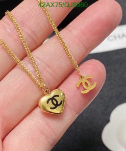 Gold heart locket and logo pendant necklace.