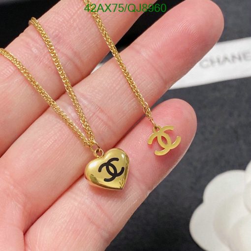 Gold heart locket and logo pendant necklace.