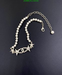 Pearl necklace with starfish and fish pendant.