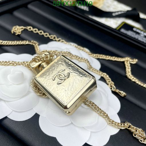 Gold chain perfume bottle pendant.