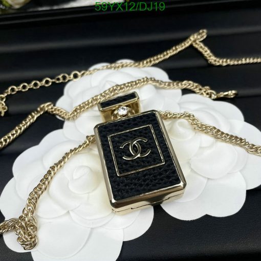 Designer perfume bottle pendant on gold chain.