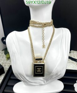 Gold necklace on white mannequin display.