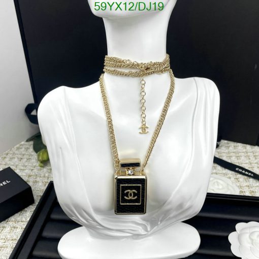 Gold necklace on white mannequin display.