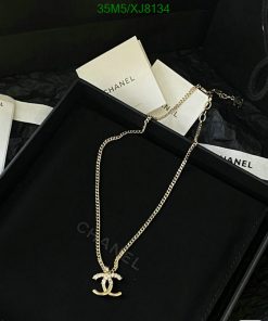 Chanel necklace with logo pendant in elegant presentation box.