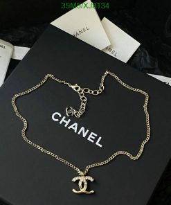 Designer necklace on branded packaging.