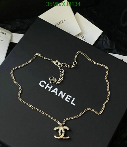 Designer necklace on branded packaging.