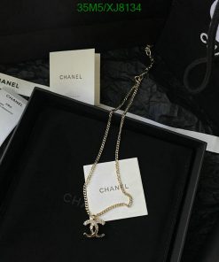 Chanel necklace with pendant in black presentation box.