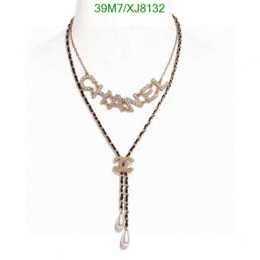 Diamond-encrusted word pendant with floral charm necklace.