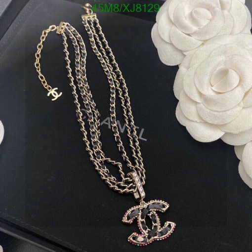 Designer logo pendant necklace with white flowers.