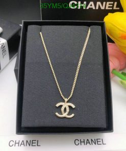 Gold pendant necklace in branded box.