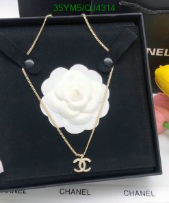 Gold designer logo necklace displayed in elegant box.