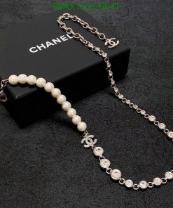 Chanel pearl and crystal necklace on black presentation box.