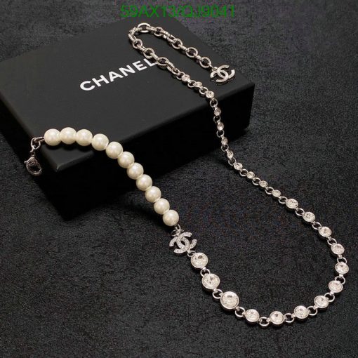 Chanel pearl and crystal necklace on black presentation box.