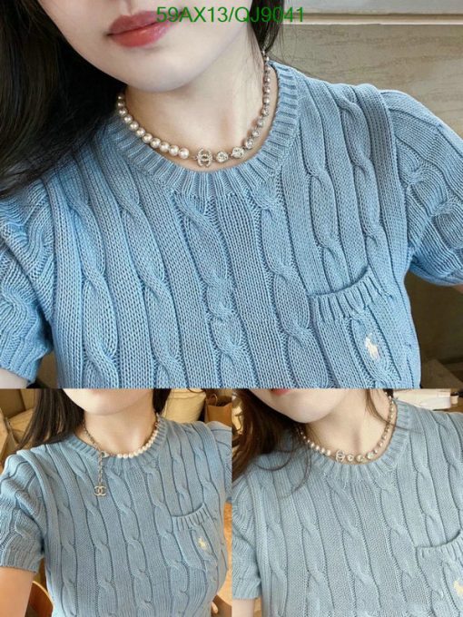 Woman wearing blue cable knit sweater with pearl necklace.