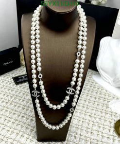 Elegant pearl necklace on display with silver details.