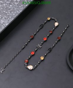 Black chain necklace with colorful gemstone accents.