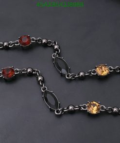 Black chain bracelet with colorful gemstones.