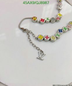 Colorful charm bracelet on white surface.