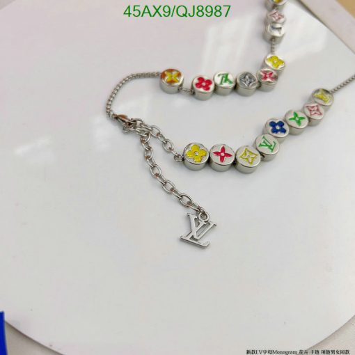 Colorful charm bracelet on white surface.