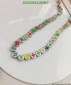 Colorful designer logo necklace on white background.