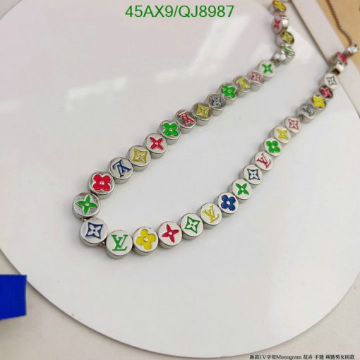 Colorful designer logo necklace on white background.