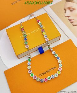 Multicolored designer charm necklace on branded box.