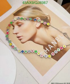 Ad print featuring colorful designer necklace on model.